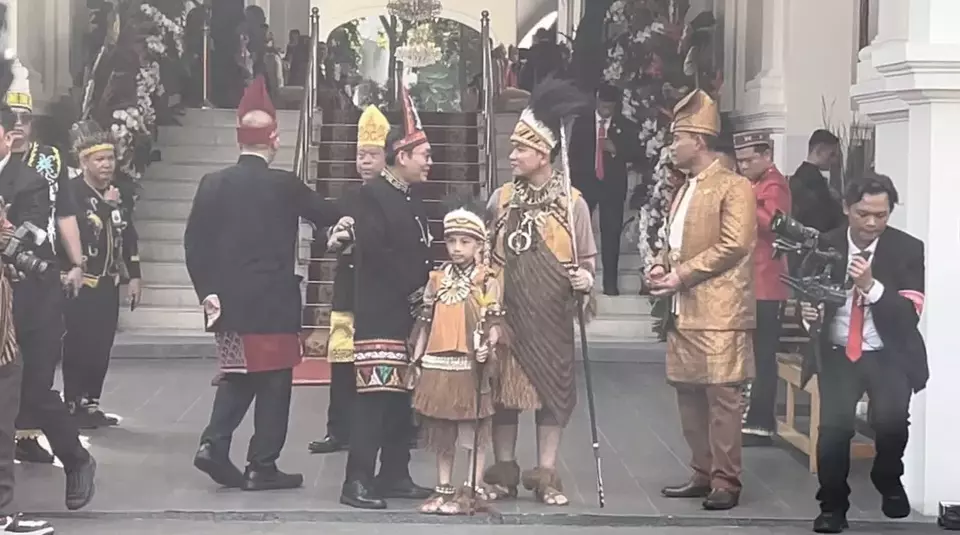 Image Credit Special/Beritasatu - Vice President-elect Gibran Rakabuming Raka and his son Jan Ethes wore traditional Papuan clothing to witness the commemoration of the proclamation moments in the context of the 79th Anniversary of the Republic of Indonesia.