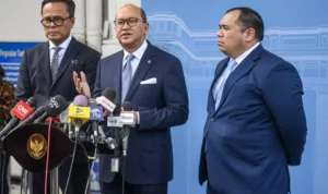 Image Credit Muhammad Adimaja/Antara - Danantara's chief executive officer Rosan Roeslani (center), the fund's chief operations officer Dony Oskaria (left) and its chief investment officer Pandu Sjahrir (right) speak to reporters at the State Palace in Jakarta on Feb. 24, 2025.