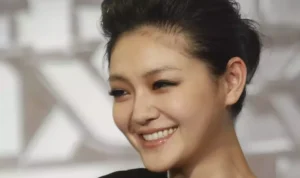 Image Credit Chiang Ying-ying/AP - Taiwanese actress Barbie Hsu smiles during an event to promote her new movie "Future X-Cops," Monday, March 29, 2010, in Taipei, Taiwan.