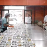 Image Credit Courtesy of Presidential Press Bureau - President Prabowo Subianto inspects a public kitchen in East Jakarta area on Feb. 3, 2025. The kitchen is in charge of making the lunchplates that will be distributed as part of Prabowo's free meal program.