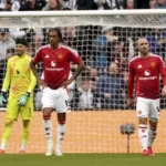 Image Credit Owen Humphreys/AP - Manchester United players Leny Yoro (left) and Christian Eriksen show their disappointment after conceding a goal during the Newcastle United vs MU match in Newcastle upon Tyne, England, Sunday, April 13, 2025.