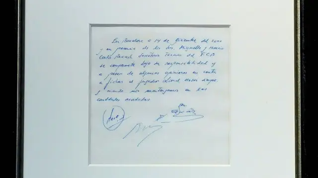 Image Credit Timothy A. Clary/AFP - A napkin on which is written the first promise of the contract to secure 13-year-old Lionel Messi for FC Barcelona, ​​on display at Bonhams, New York, on March 5, 2024.